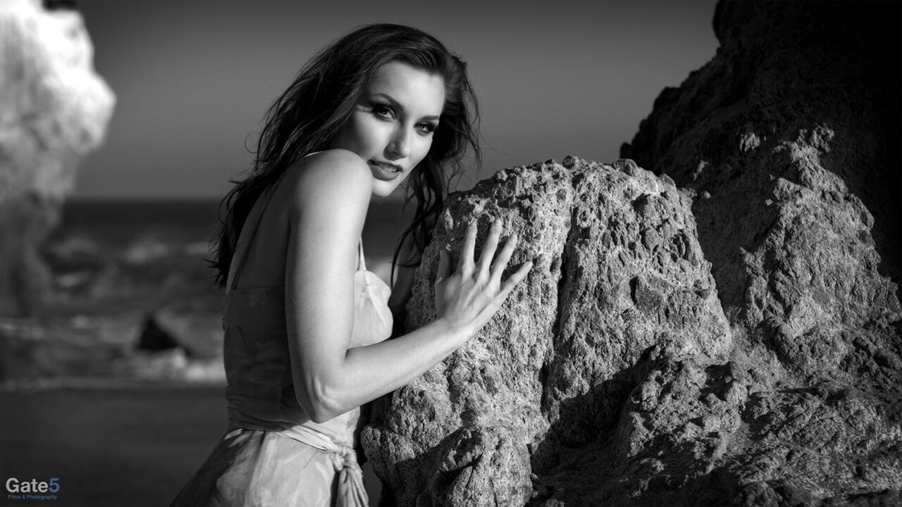 a woman on the beach in the fashion film c'est l'amour