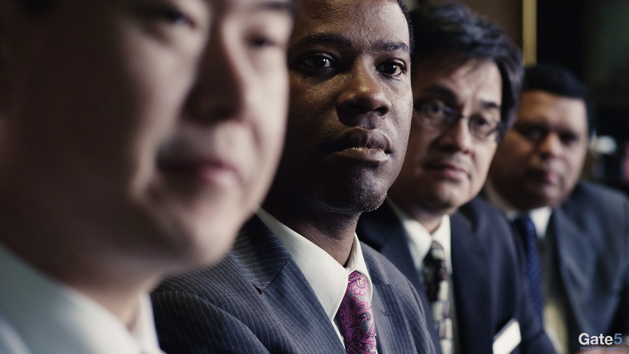 a row of business men in a corporate video production in Los Angeles