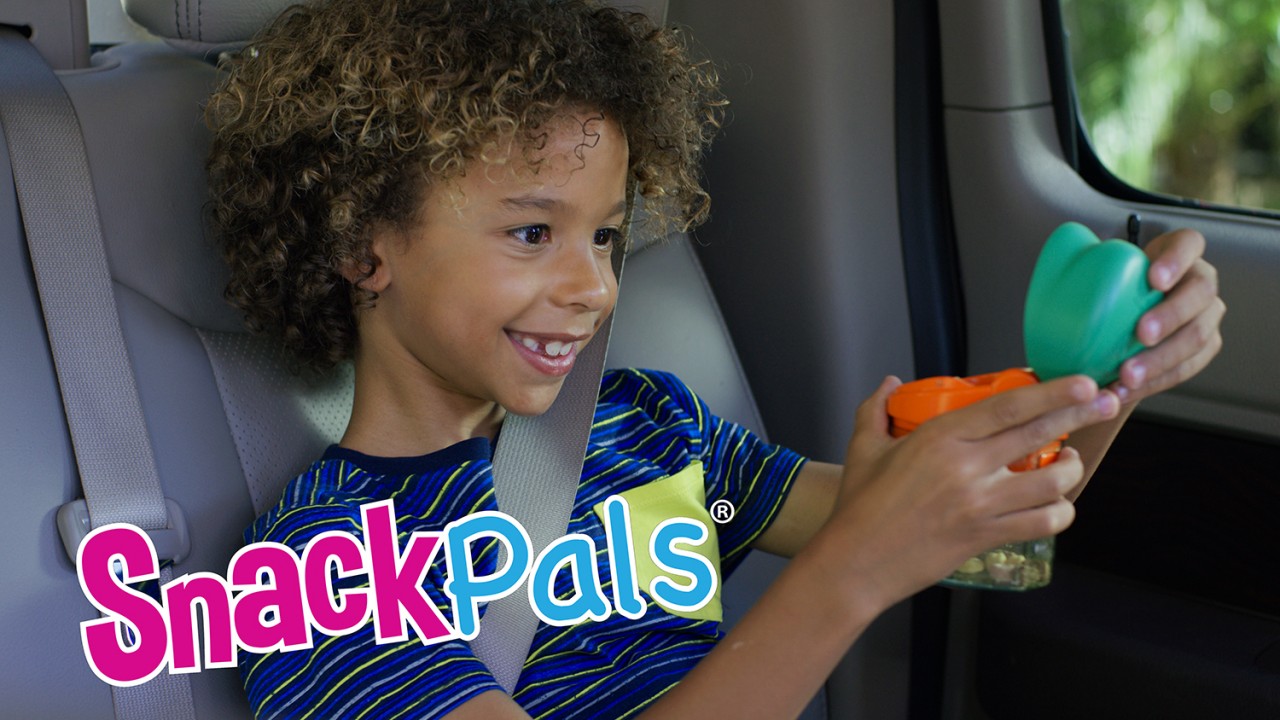 kid using snack dispenser in product commercial