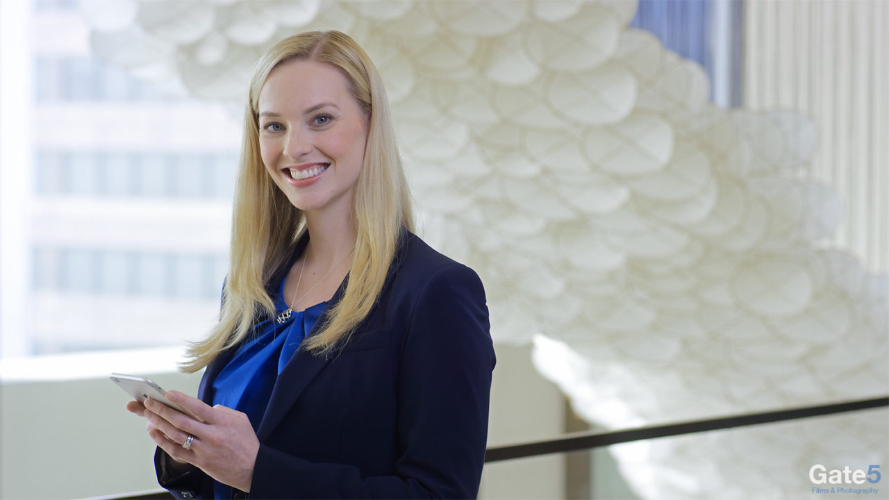 smiling woman in who we are profile employee recruitment video