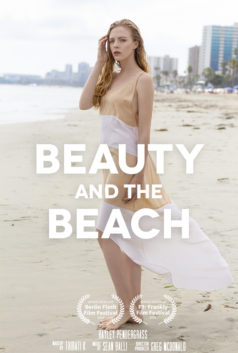 a woman on the beach in a dress in the eco fashion film directed by Greg McDonald