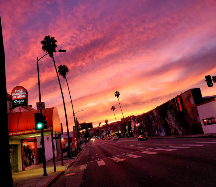 Colorful sunset of a nearly empty Sunset Blvd in Hollywood during Coronavirus stay at home order