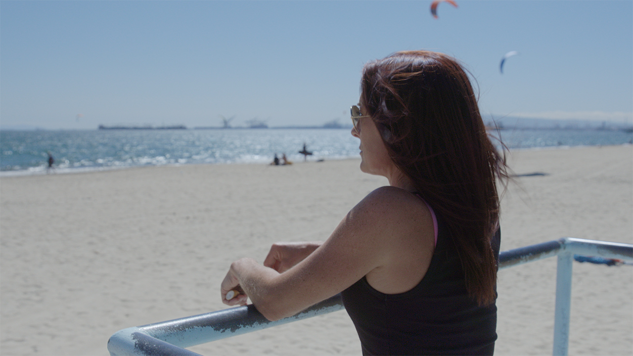 woman at the beach in an episode of a business video series on hemp